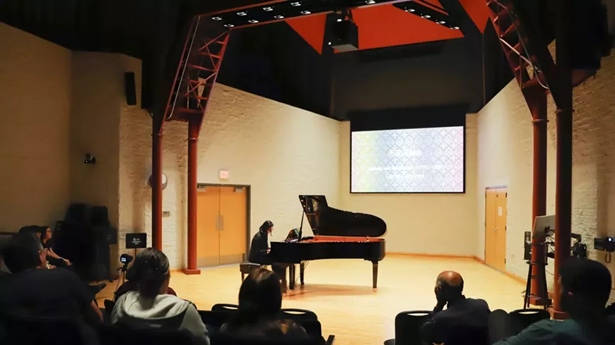 Faculty, alumni, and students perform in a celebration of piano music.